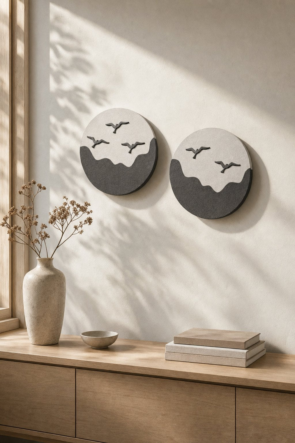 Round White & Charcoal Wave Discs with Birds – 2-piece wall art set styled on a living room wall above a wooden sideboard
